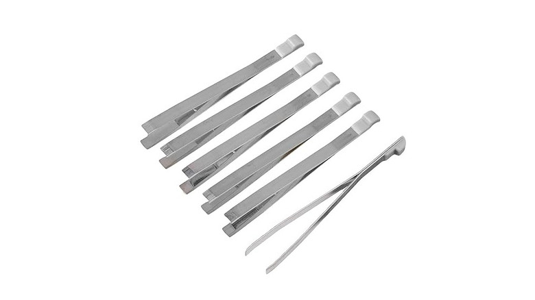 Silver Swiss Army Knife tweezers with a white background