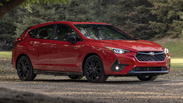 2024 Subaru Impreza RS under a tree