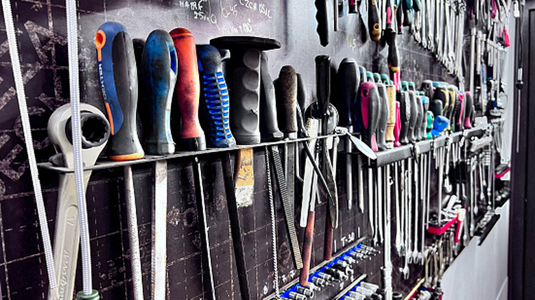 closeup of hand tools stored in a garage