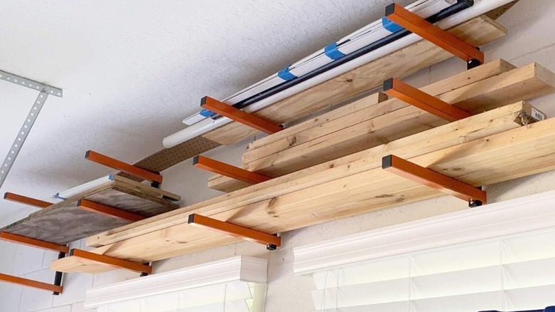 lumber storage rack high up on a wall