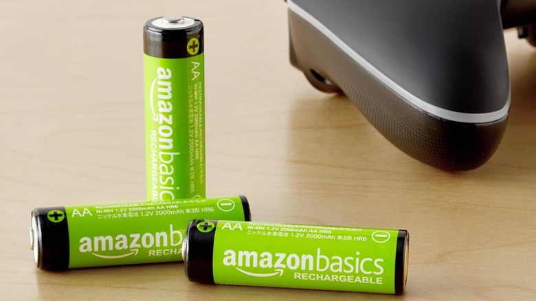 Amazon Basics Rechargeable High-Capacity AA Batteries beside a game controller