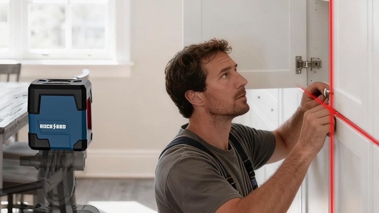 man using laser level