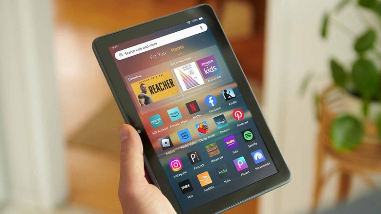 A person holding the Amazon Fire HD 8 tablet.