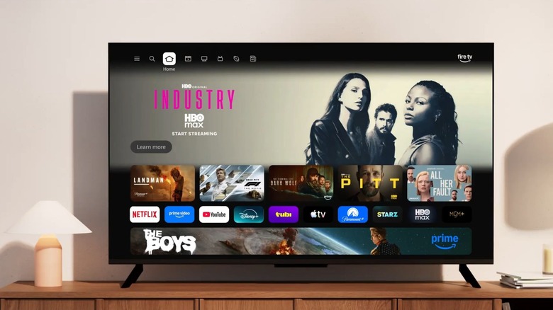 A TV on a stand with the Amazon Fire TV Stick interface.