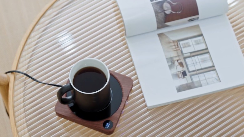 Overhead view of coffee cup on mug warmer
