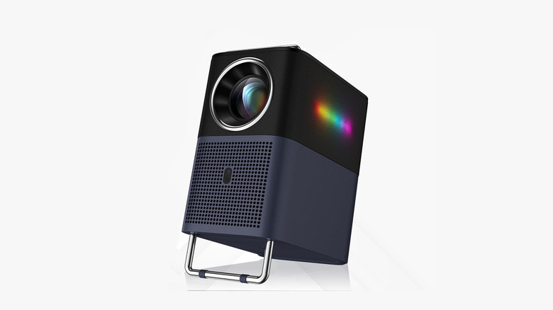 TCL portable projector sitting on a built-in stand, pictured against a plain background.