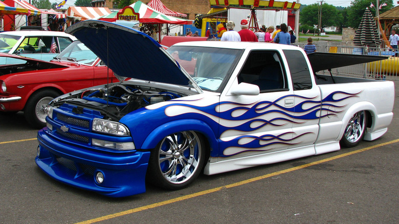 A white Chevy S-10 Lowrider with blue flames