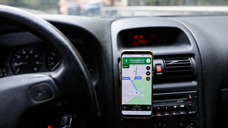 Android phone in car mount displaying map
