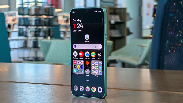 OnePlus 15R standing upright on a desk