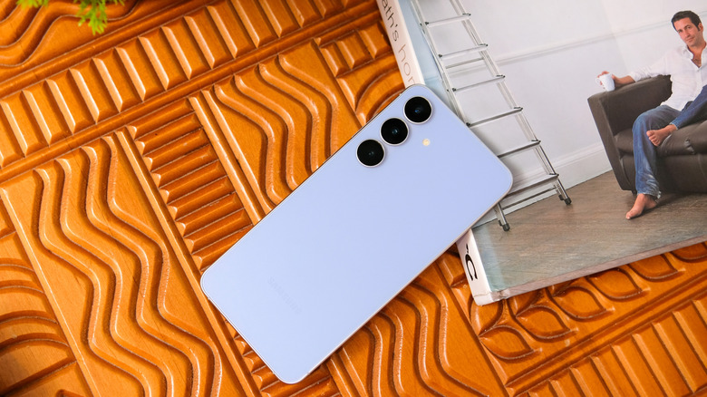 Galaxy S25 FE next to a book