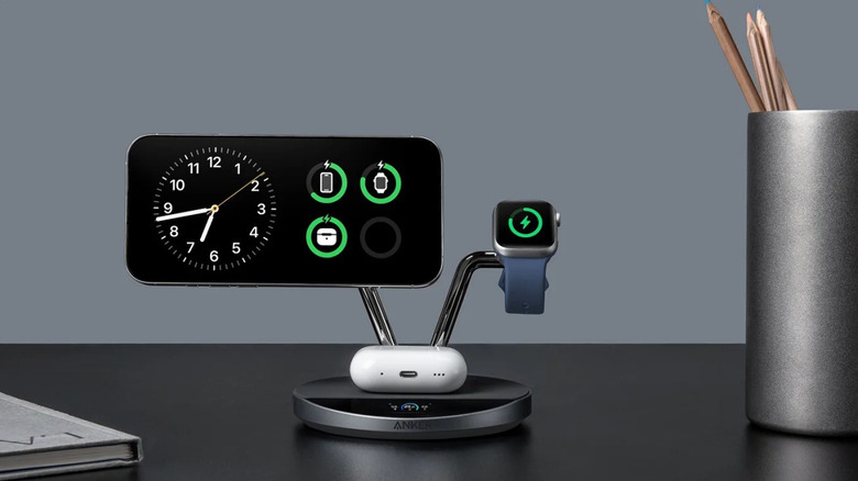 The Anker Prime Wireless Charging Station, showing an iPhone, an Apple Watch, and an AirPods case being charged