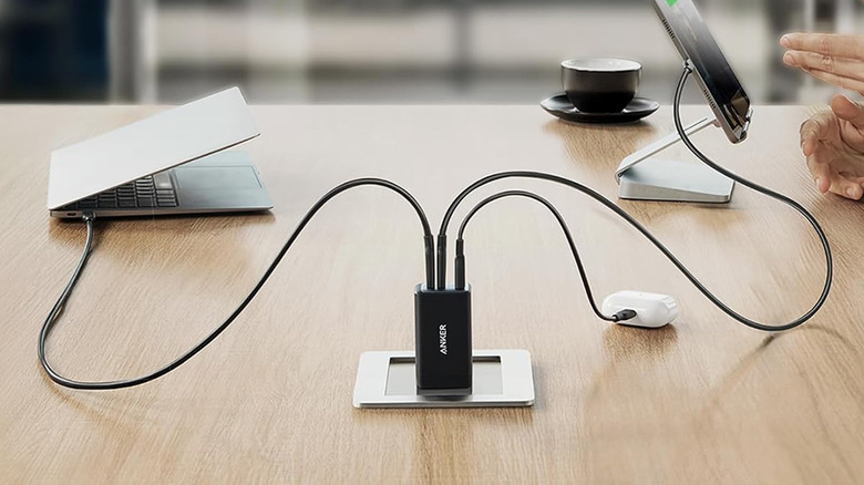 Anker Nano II adapter charging three devices at the same time.
