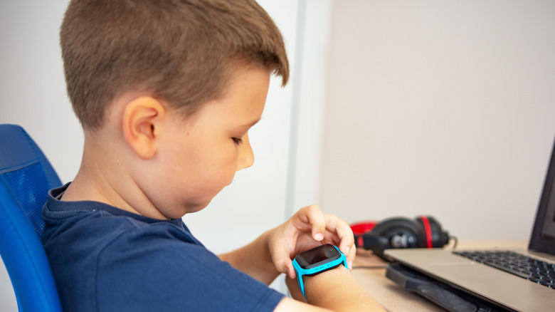 child using smartwatch