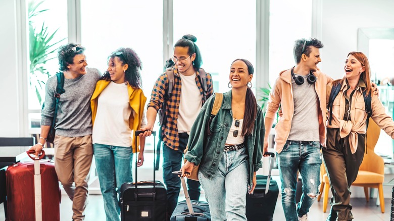 tourists with suitcases