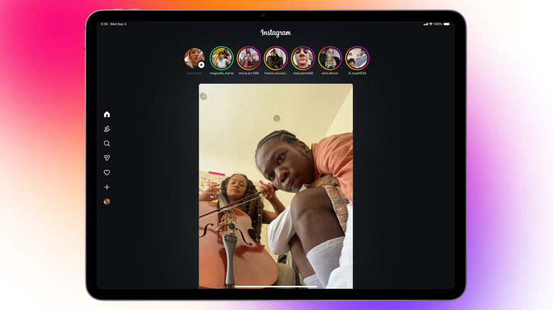 The Instagram app displayed on an iPad in front of a multi-colored background.