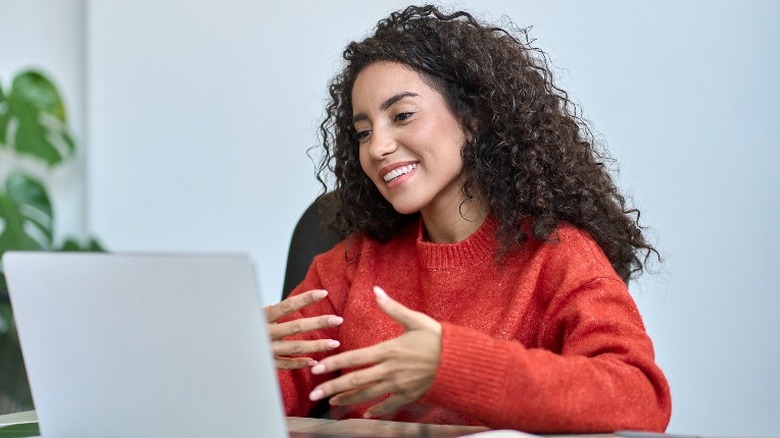 person video chatting on laptop
