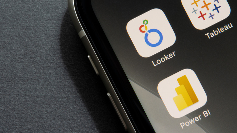Looker, Tableau, and Power BI app icons are seen on an iPhone