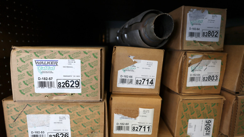 Several auto parts in boxes waiting to be shipped.