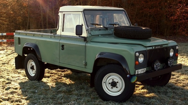 Early Land Rover 110 Pickup in a field