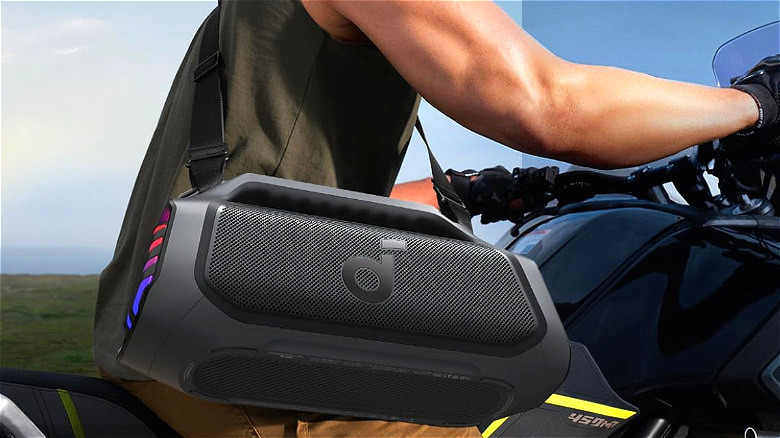 A person on a bike carries the Anker Soundcore Boom 2 Plus.