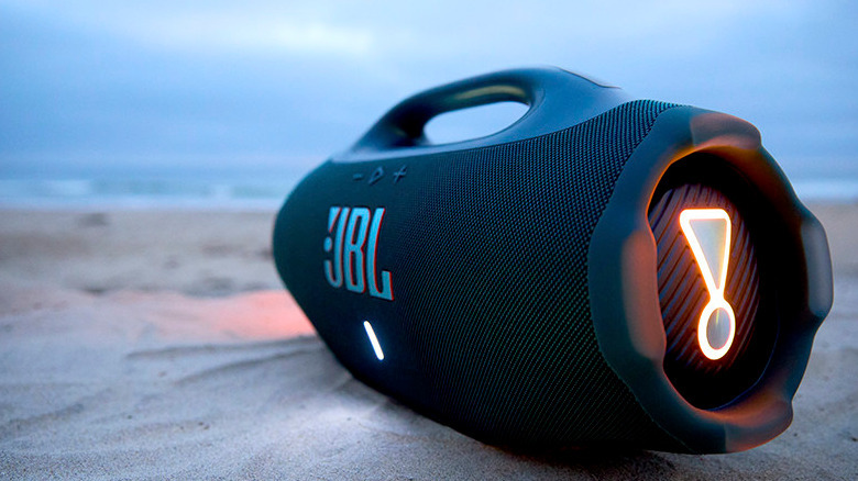 The JBL Boombox 4 on sand.