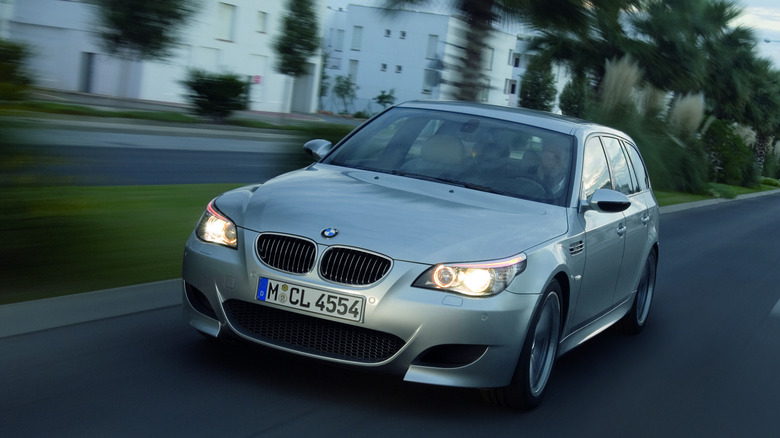 BMW E60 M5 Touring equipped with S85 V10 engine, driving on road, front view
