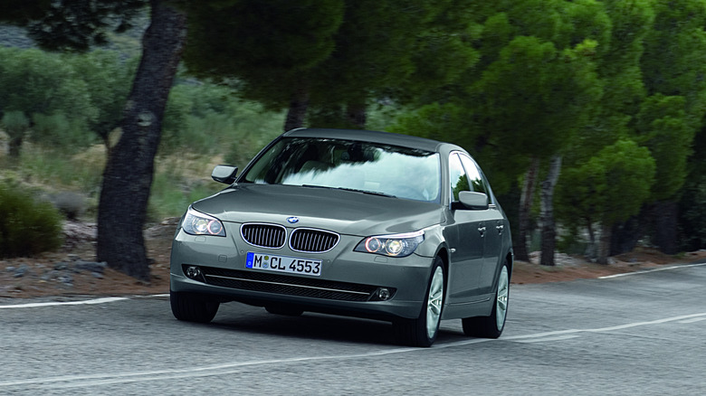 2008 BMW 5-series driving on country road, front-view