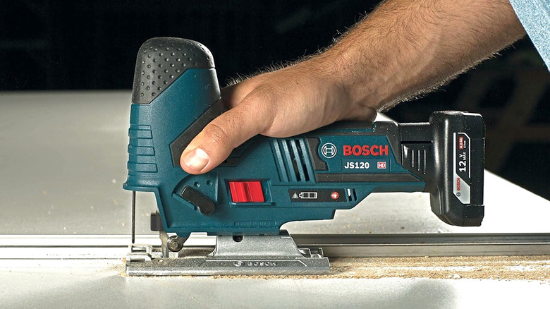 Person using 12V Max Bosch jig saw