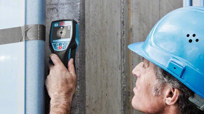 man using Bosch Professional Wall Scanner