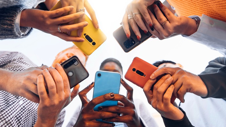 people using coloured smartphones