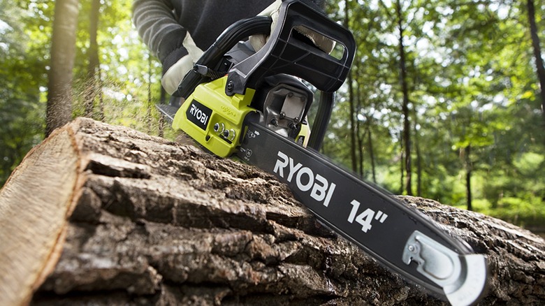 Ryobi gas chainsaw cutting wood