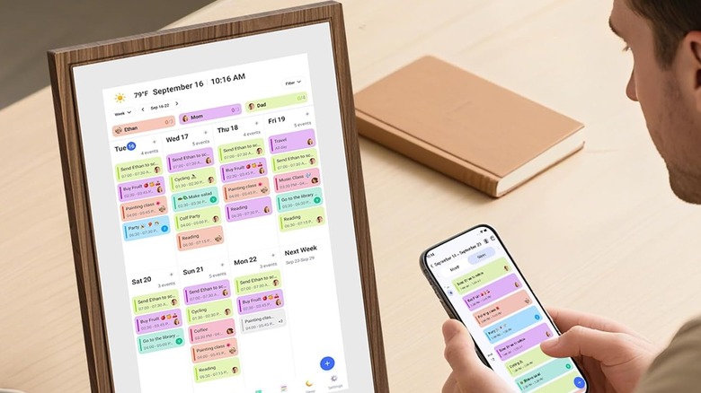man using digital calendar on table