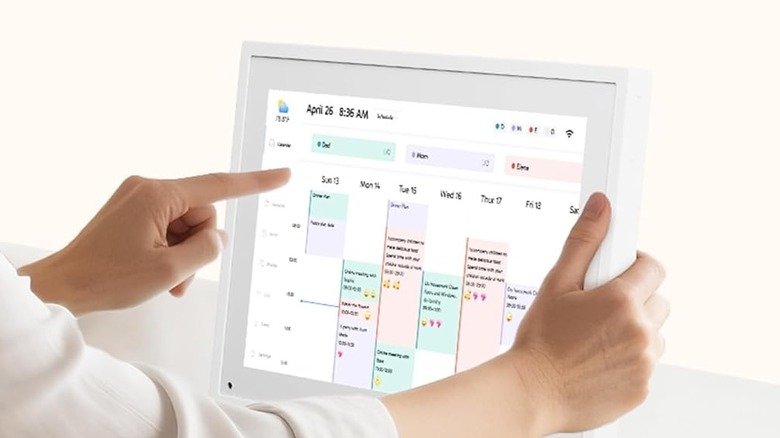 woman pressing digital calendar screen