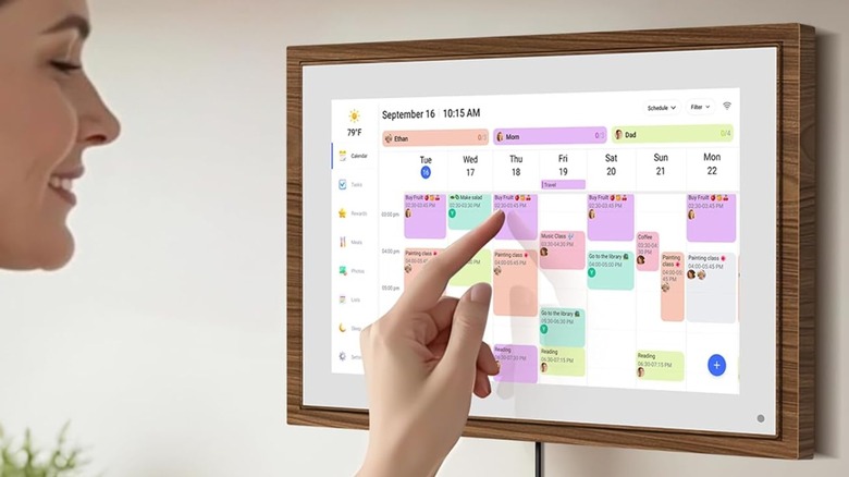 woman using wall digital calendar