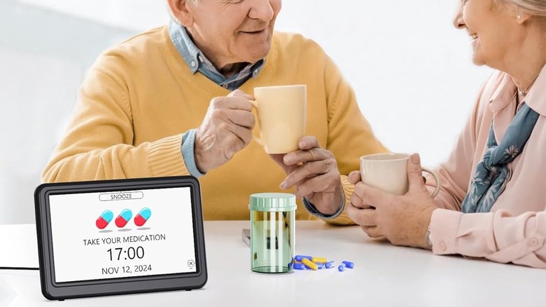 elderly couple with digital calendar