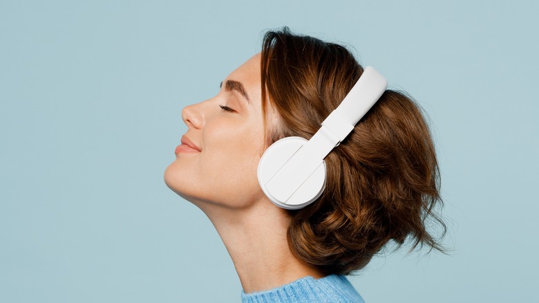 woman listening to headphones