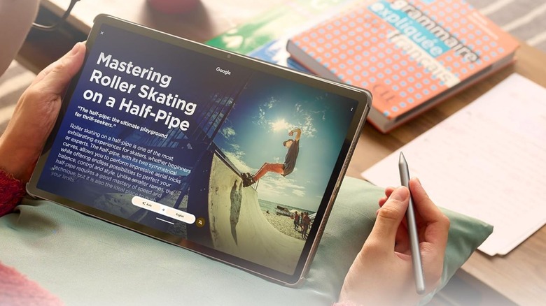 Person reading article on Lenovo Idea Tab Pro