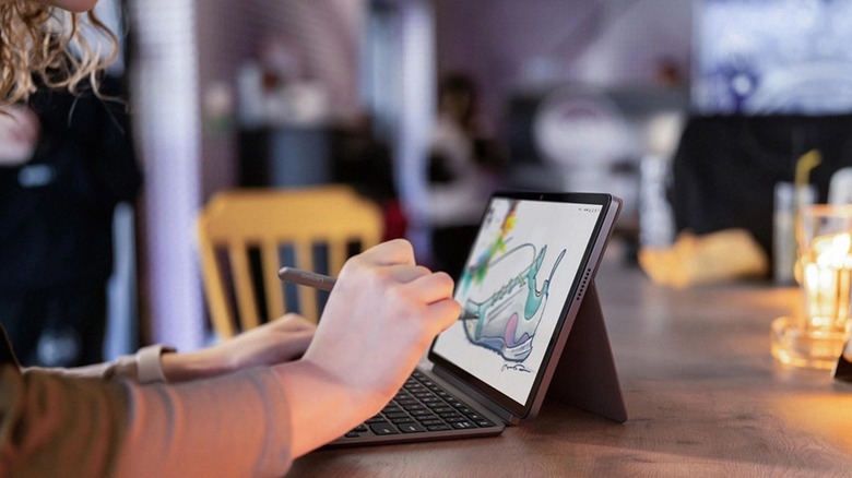 person using Lenovo Chromebook Duet at a kitchen table
