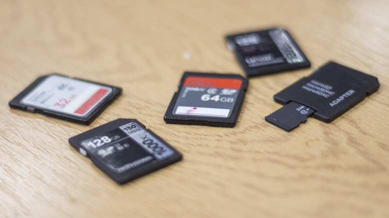 Multiple SD cards lying on top of a table