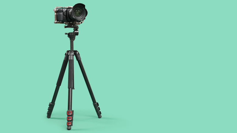 A professional camera mounted on a tripod