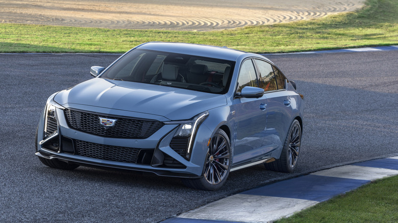 Front view of gray 2026 Cadillac CT5-V Blackwing parked on race track.