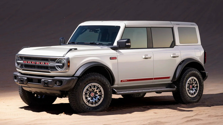 A white 2026 Bronco 60th Anniversary edition with red highlights