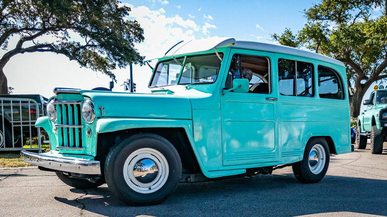 A 1963 Willys Jeep Utility Wagon in bright blue