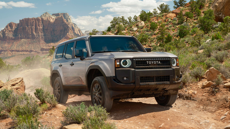A Toyota Land Cruiser 1958 edition on a dessert path