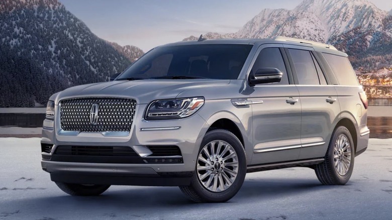 2024 Lincoln Navigator parked on snow in front of a lake