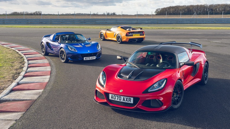 Three Lotus Exige Final Edition models parked on a racetrack