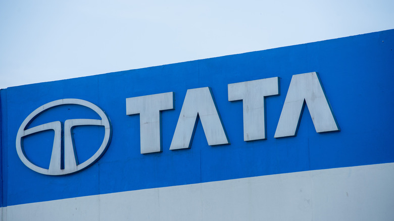Tata logo on a building against a blue sky