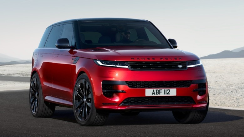 Red Range Rover Sport parked on a desert road