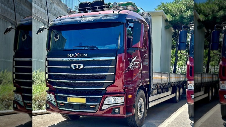 Red Tata Daewoo Maxen truck parked