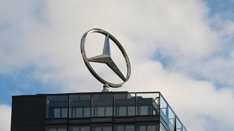 mercedes log on top of building